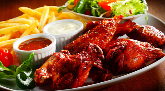 Chicken Wings with Bold Buffalo Sauce, Fresh and Zesty Touches, Creamy Blue Cheese Dip, Golden French Fries